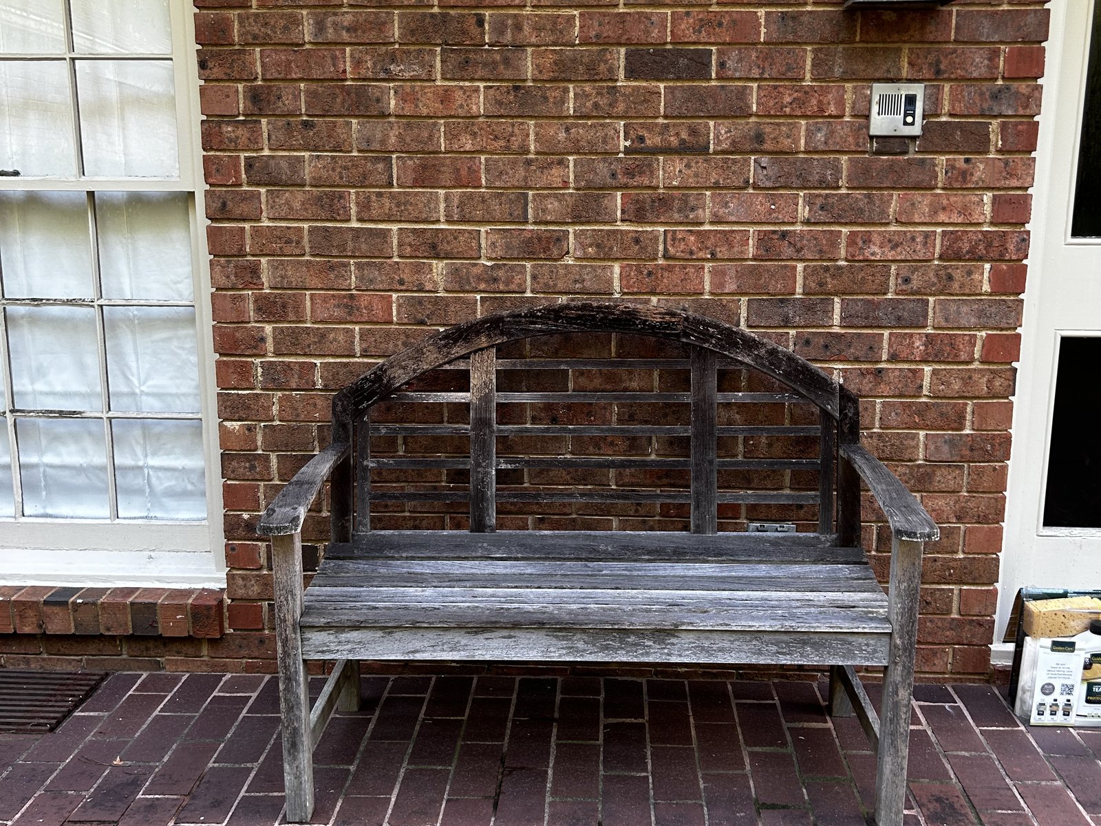 Weathered teak porch bench, before