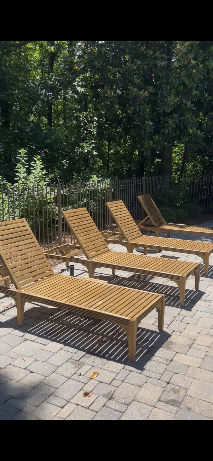 Restored teak chaise loungers, after