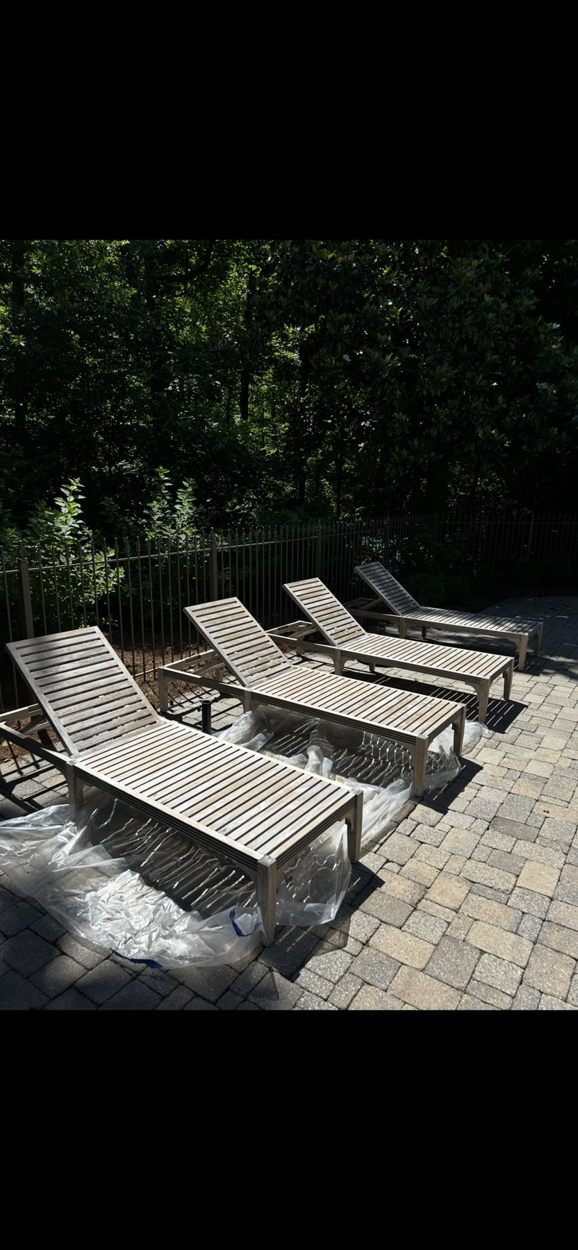 Weathered teak chaise loungers, before