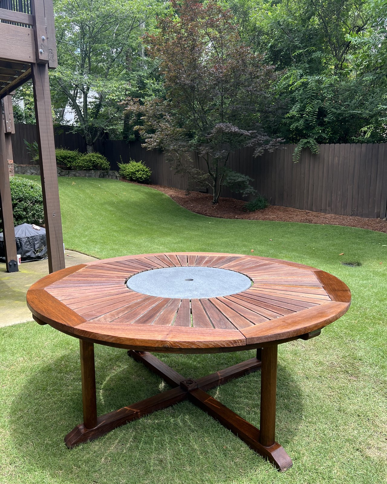 Restored teak table with stone lazy susan, after Teak Pro treatment