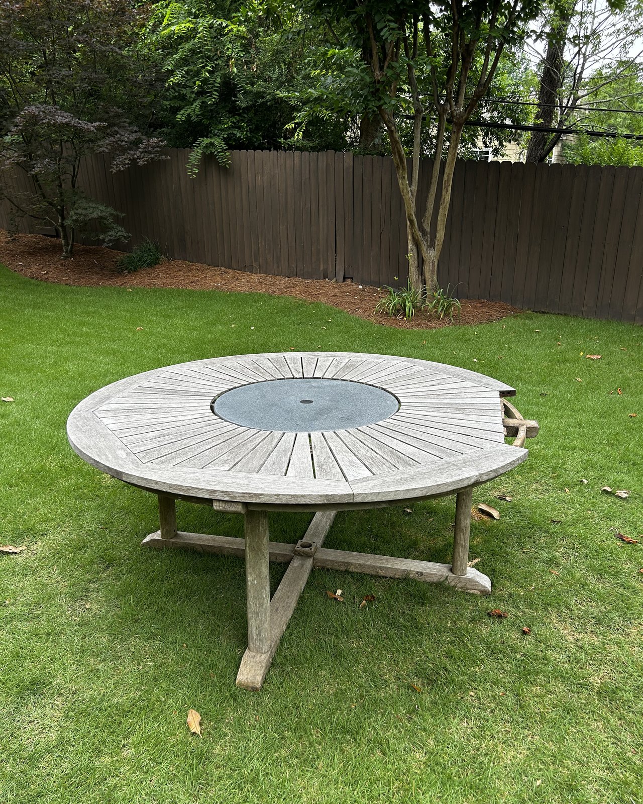 Weathered teak table with stone lazy susan, before Teak Pro treatment